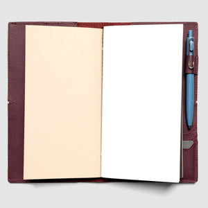 Open notebook with pen holder and pen on a light gray background