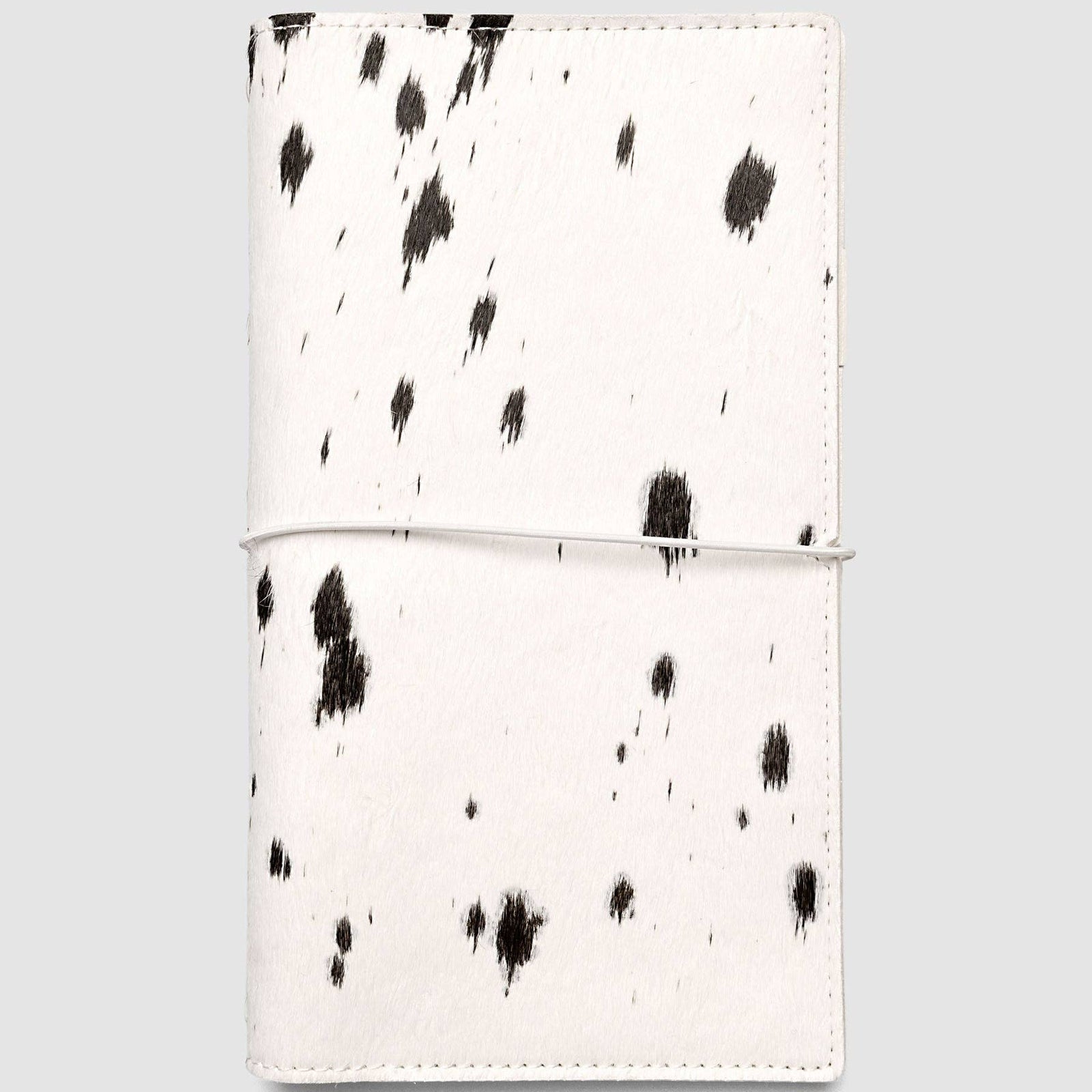 Maroon leather notebook on a light gray background