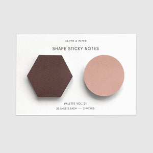 Two geometric sticky notes, one hexagonal and one circular, on a white card with text.