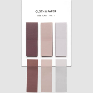 A white card labeled 'CLOTH & PAPER' and 'PAGE FLAGS | VOL. 1' displays six rectangular fabric swatches in muted dusty rose, blush, pale lavender, mauve, beige, and light gray, arranged on a light gray background.