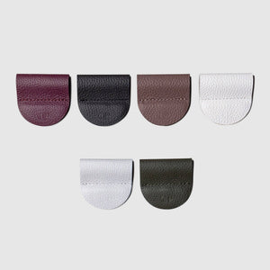 Set of six leather patches in different colors on a light gray background