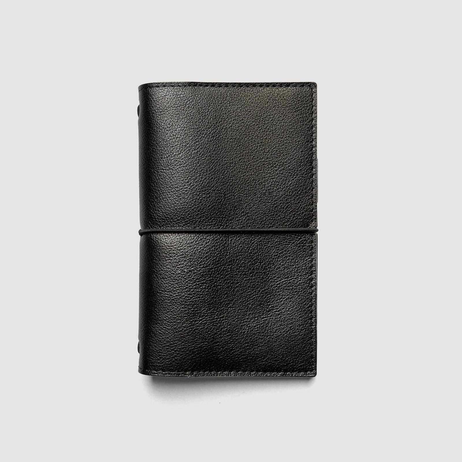 Burgundy leather wallet on a light gray background