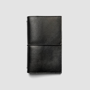 A black textured leather card holder wallet with a horizontal stitched band, shown closed on a light gray background.