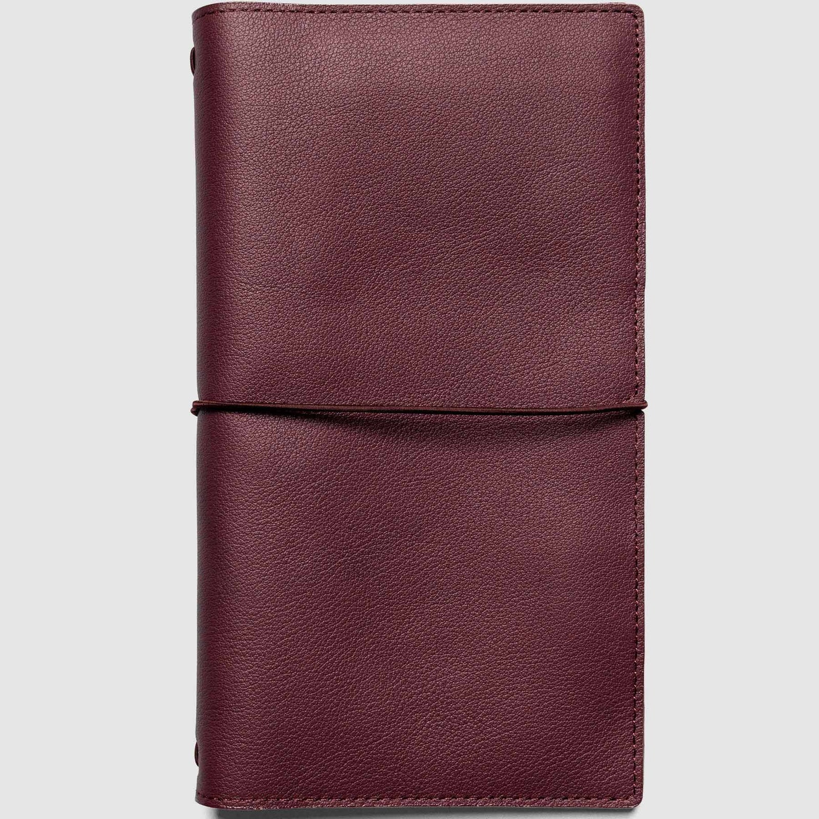 Maroon leather notebook on a light gray background