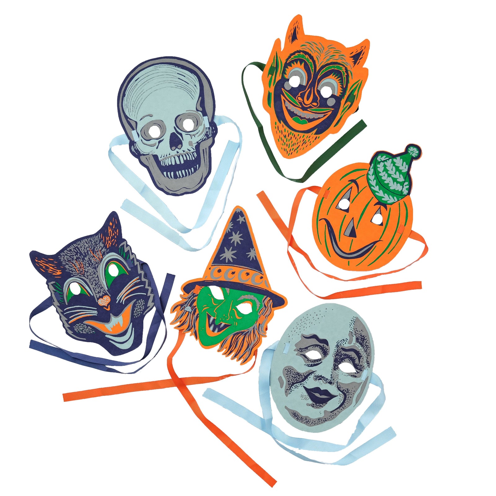 Decorative shelf with Halloween-themed masks and candles