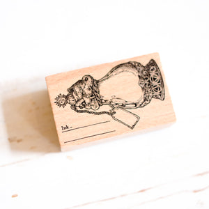 A Log of Elixir Wood Stamp